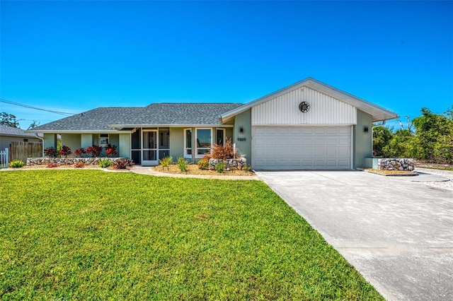 9869 Gulfstream Blvd, Englewood, FL 34224 - single story home with a garage, concrete driveway, and stucco siding