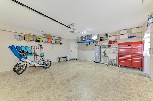9869 Gulfstream Blvd, Englewood, FL 34224 - garage with electric water heater and a garage door opener