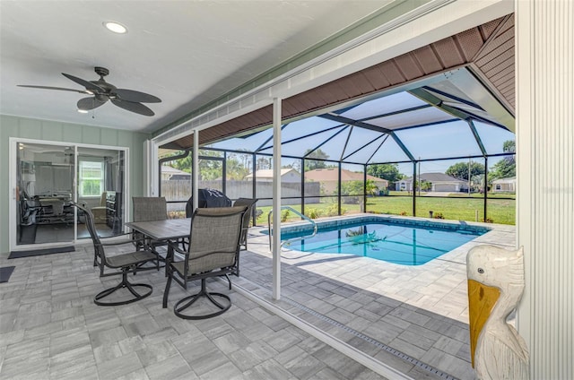 9869 Gulfstream Blvd, Englewood, FL 34224 - swimming pool with a patio, ceiling fan, a yard, and glass enclosure