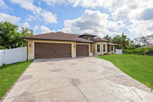 2758 Morrietta Ln, North Port, FL 34286 - prairie-style house with concrete driveway, stucco siding, an attached garage, and a gate
