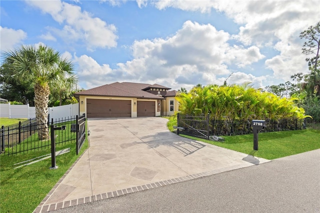 2758 Morrietta Ln, North Port, FL 34286 - view of front of house featuring concrete driveway, an attached garage, stucco siding, and a gate