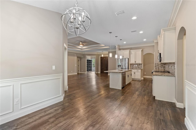 2758 Morrietta Ln, North Port, FL 34286 - kitchen featuring arched walkways, open floor plan, a center island with sink, pendant lighting, and crown molding