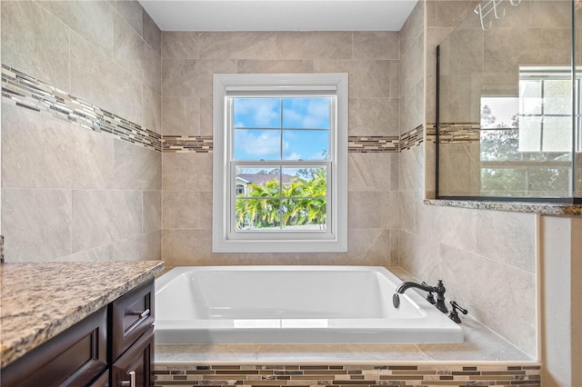 2758 Morrietta Ln, North Port, FL 34286 - full bathroom with a garden tub and tile walls