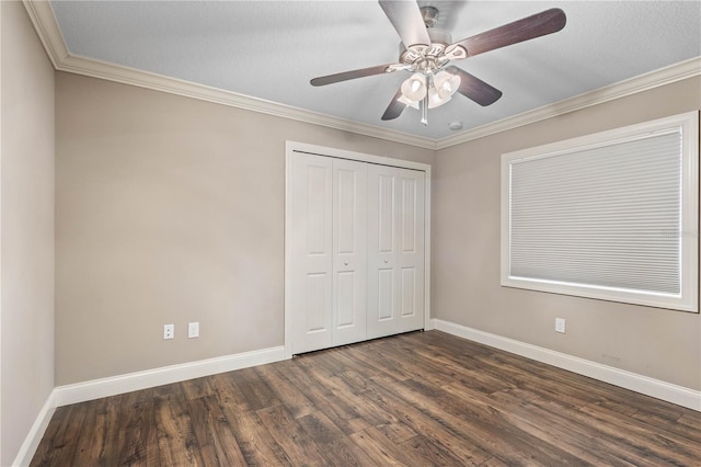 2758 Morrietta Ln, North Port, FL 34286 - unfurnished bedroom with dark wood-style flooring, baseboards, a closet, crown molding, and ceiling fan