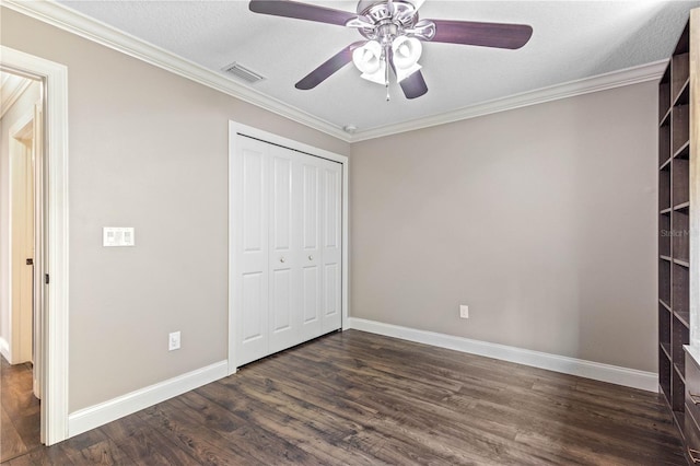 2758 Morrietta Ln, North Port, FL 34286 - unfurnished bedroom with dark wood finished floors, ornamental molding, baseboards, a closet, and a ceiling fan