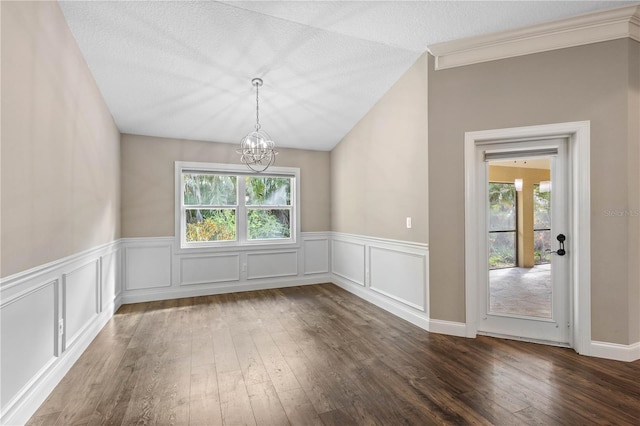 2758 Morrietta Ln, North Port, FL 34286 - unfurnished dining area featuring a chandelier, hardwood / wood-style flooring, a wainscoted wall, crown molding, and a decorative wall