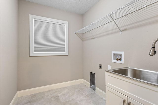 2758 Morrietta Ln, North Port, FL 34286 - laundry area featuring cabinet space, electric dryer hookup, hookup for a washing machine, and baseboards