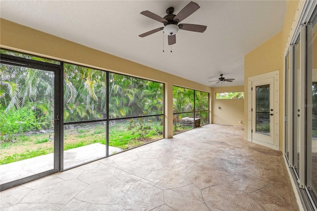 2758 Morrietta Ln, North Port, FL 34286 - unfurnished sunroom with lofted ceiling and stone finish flooring