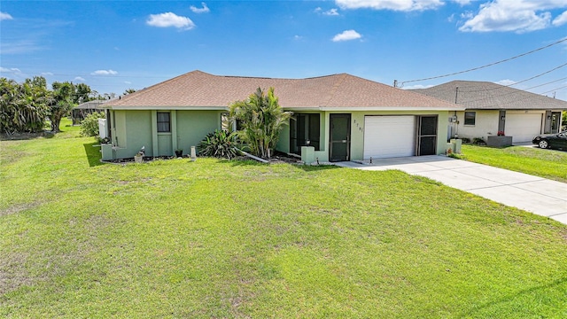 279 Mark Twain Ln, Rotonda West, FL 33947 - ranch-style house featuring stucco siding, a front lawn, driveway, and roof with shingles