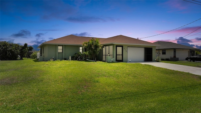 279 Mark Twain Ln, Rotonda West, FL 33947 - single story home with an attached garage, concrete driveway, a yard, and stucco siding