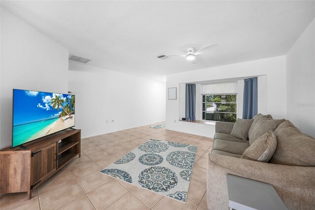 279 Mark Twain Ln, Rotonda West, FL 33947 - living area featuring light tile patterned flooring and a ceiling fan