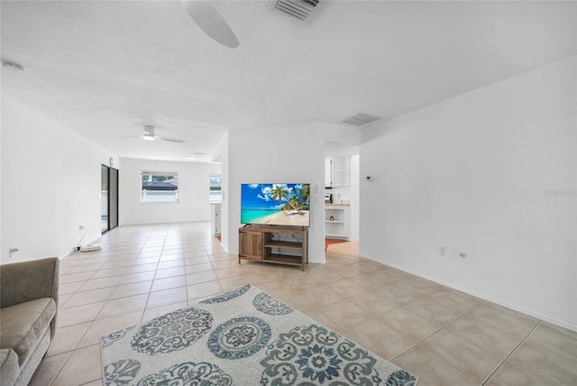 279 Mark Twain Ln, Rotonda West, FL 33947 - living room featuring ceiling fan and light tile patterned floors