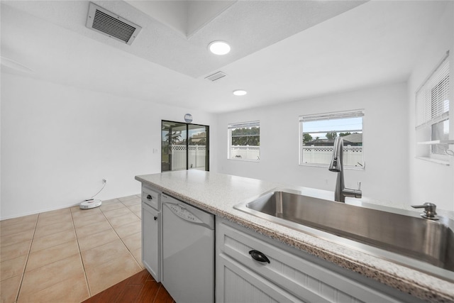 279 Mark Twain Ln, Rotonda West, FL 33947 - kitchen featuring dishwasher, a sink, light countertops, and recessed lighting