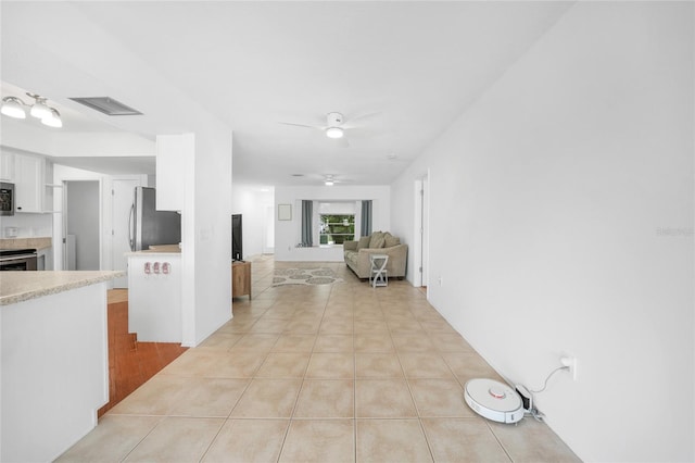279 Mark Twain Ln, Rotonda West, FL 33947 - hallway with light tile patterned floors