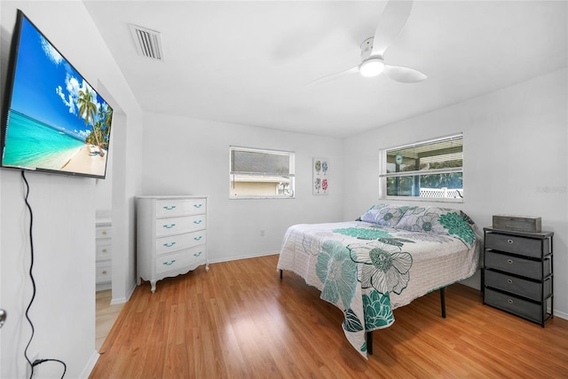 279 Mark Twain Ln, Rotonda West, FL 33947 - bedroom featuring wood finished floors, baseboards, and ceiling fan
