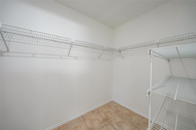 279 Mark Twain Ln, Rotonda West, FL 33947 - walk in closet with light tile patterned floors