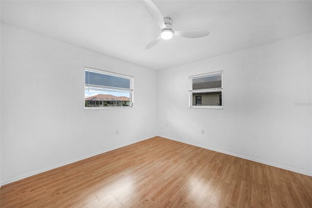 279 Mark Twain Ln, Rotonda West, FL 33947 - spare room featuring light wood finished floors, baseboards, and ceiling fan
