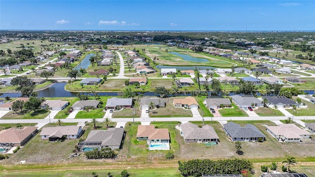279 Mark Twain Ln, Rotonda West, FL 33947 - aerial view of property and surrounding area with nearby suburban area and a large body of water