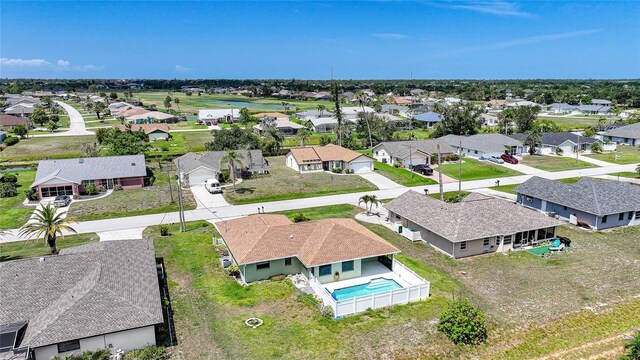 279 Mark Twain Ln, Rotonda West, FL 33947 - aerial view of residential area with a pool area