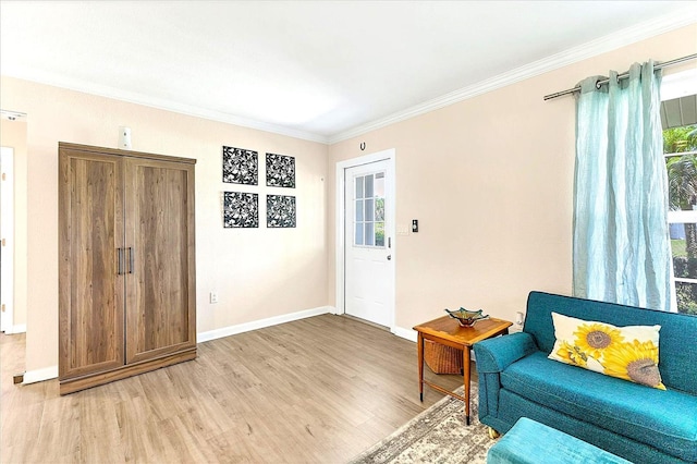 305 E Wentworth Cir, Englewood, FL 34223 - living area with light wood-style flooring, crown molding, and baseboards