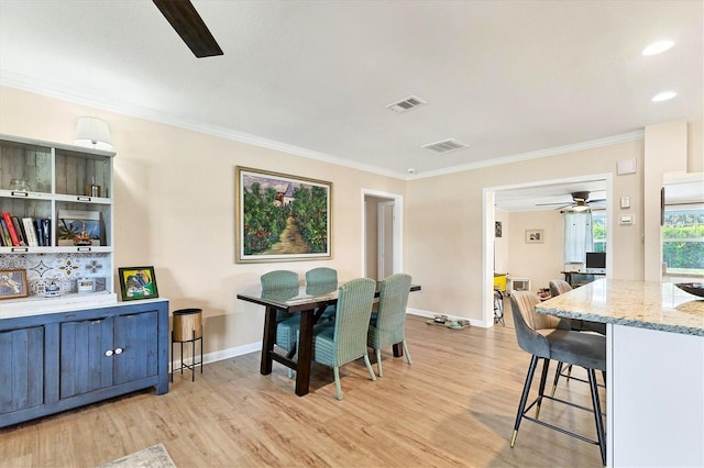 305 E Wentworth Cir, Englewood, FL 34223 - dining space with ceiling fan, ornamental molding, light wood-style floors, and baseboards