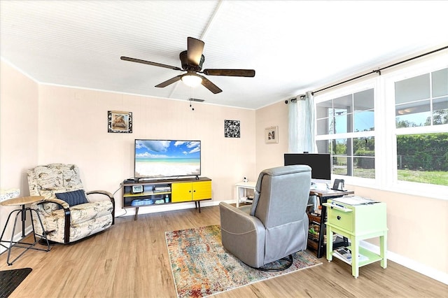 305 E Wentworth Cir, Englewood, FL 34223 - living area featuring wood finished floors, a ceiling fan, a desk, and baseboards