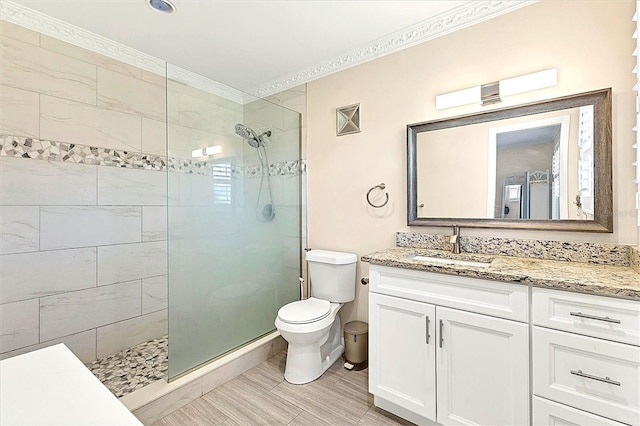 305 E Wentworth Cir, Englewood, FL 34223 - full bath with a tile shower, toilet, vanity, and ornamental molding
