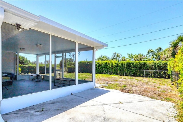 305 E Wentworth Cir, Englewood, FL 34223 - view of patio featuring a sunroom