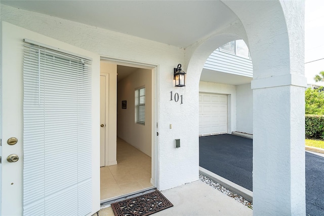 3929 Cape Haze Dr Unit 101, Rotonda West, FL 33947 - property entrance with stucco siding