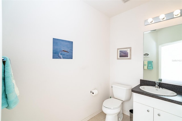 3929 Cape Haze Dr Unit 101, Rotonda West, FL 33947 - bathroom featuring vanity, toilet, tile patterned floors, and baseboards