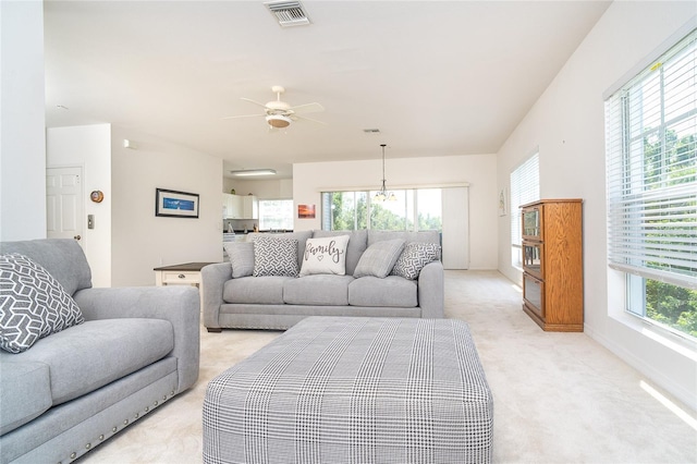 3929 Cape Haze Dr Unit 101, Rotonda West, FL 33947 - living room with light carpet, ceiling fan, and baseboards