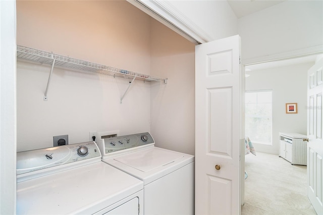 3929 Cape Haze Dr Unit 101, Rotonda West, FL 33947 - washroom with independent washer and dryer and light carpet