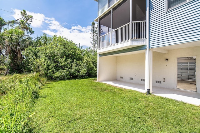 3929 Cape Haze Dr Unit 101, Rotonda West, FL 33947 - view of green lawn with a patio area