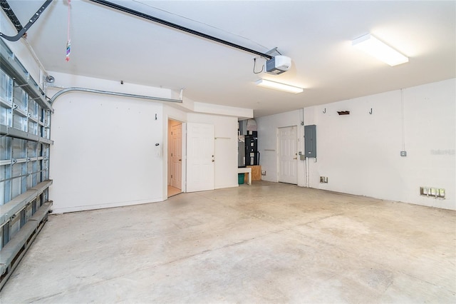 3929 Cape Haze Dr Unit 101, Rotonda West, FL 33947 - garage featuring electric panel, a garage door opener, and heating unit
