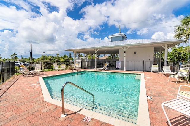 3929 Cape Haze Dr Unit 101, Rotonda West, FL 33947 - community pool with a patio area
