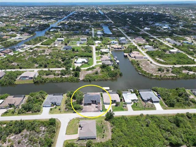 aerial perspective of suburban area with a nearby body of water