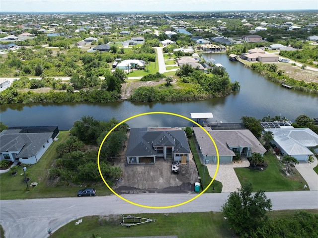 aerial view of residential area with a nearby body of water