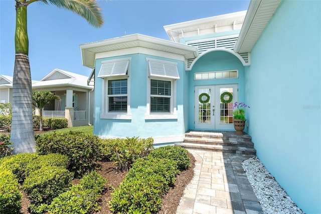 8952 Scallop Way, Placida, FL 33946 - property entrance with french doors and stucco siding