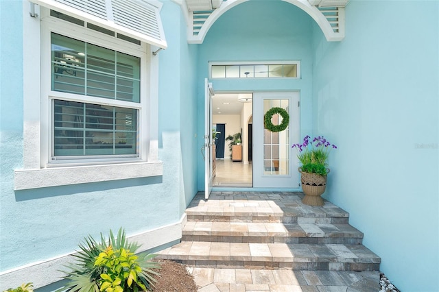 8952 Scallop Way, Placida, FL 33946 - doorway to property featuring stucco siding