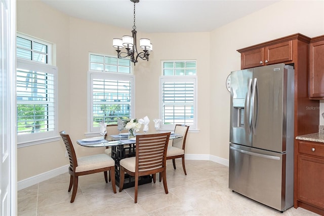 8952 Scallop Way, Placida, FL 33946 - dining area with a chandelier, baseboards, and light tile patterned flooring