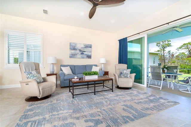 8952 Scallop Way, Placida, FL 33946 - living area with tile patterned flooring, ceiling fan, and baseboards