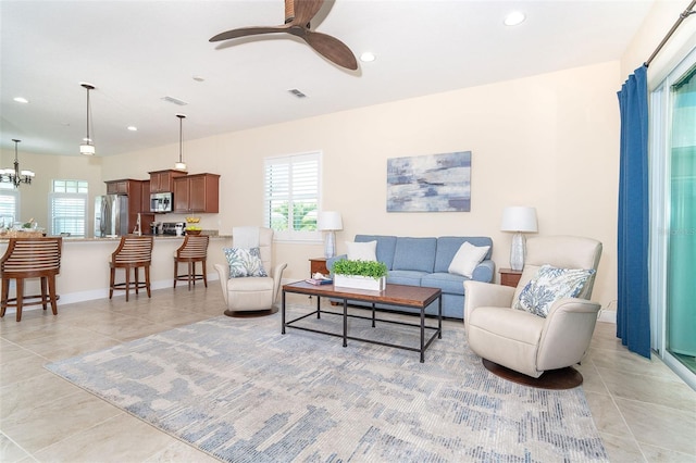 8952 Scallop Way, Placida, FL 33946 - living area with light tile patterned floors, healthy amount of natural light, recessed lighting, a ceiling fan, and baseboards