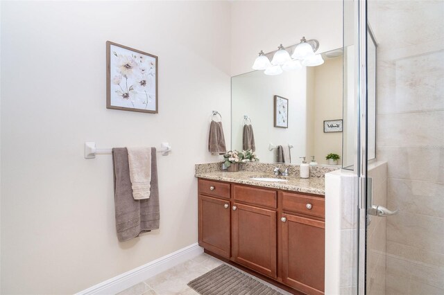 8952 Scallop Way, Placida, FL 33946 - full bathroom with a shower stall, baseboards, vanity, and tile patterned floors