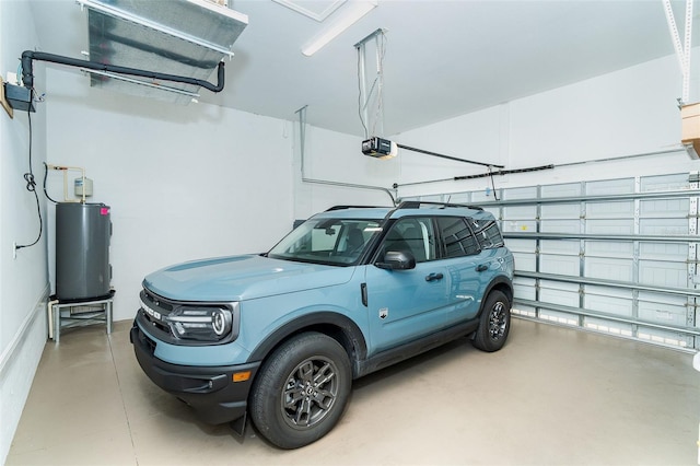 8952 Scallop Way, Placida, FL 33946 - garage featuring water heater and a garage door opener
