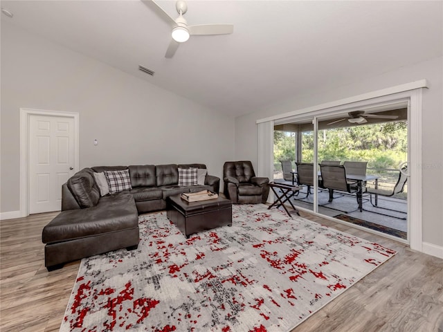 3695 Waffle Ter, North Port, FL 34286 - living area featuring a ceiling fan, vaulted ceiling, wood finished floors, and baseboards