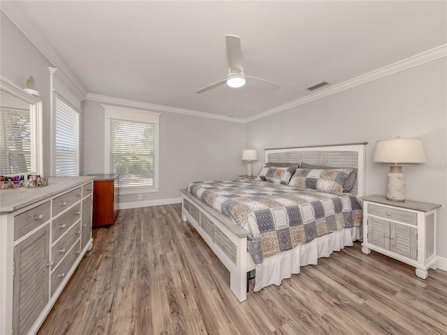 3695 Waffle Ter, North Port, FL 34286 - bedroom featuring baseboards, wood finished floors, crown molding, and ceiling fan