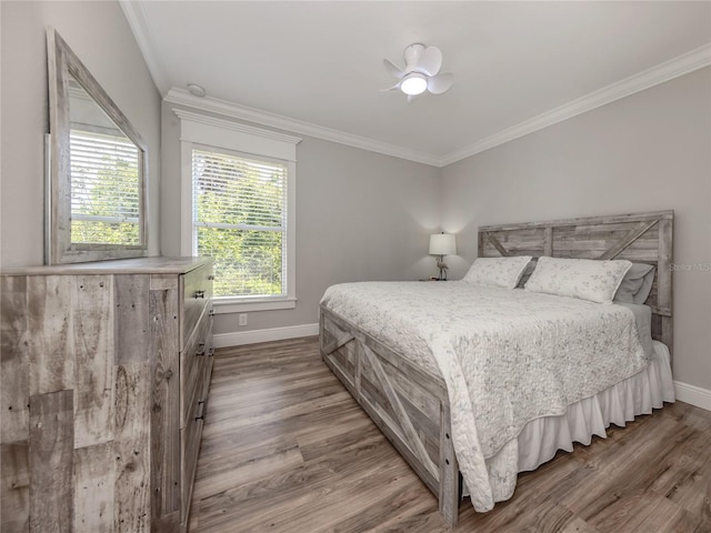 3695 Waffle Ter, North Port, FL 34286 - bedroom with baseboards, wood finished floors, crown molding, and ceiling fan