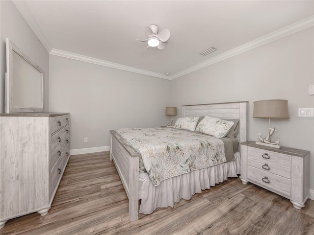 3695 Waffle Ter, North Port, FL 34286 - bedroom with wood finished floors, baseboards, ornamental molding, and ceiling fan