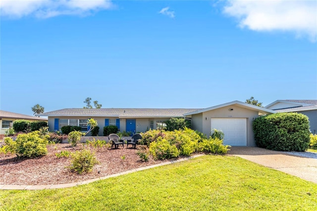 146 Rotonda Cir, Rotonda West, FL 33947 - single story home with concrete driveway, stucco siding, a garage, and a front lawn