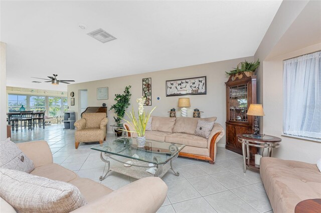 146 Rotonda Cir, Rotonda West, FL 33947 - living room featuring light tile patterned floors and a ceiling fan